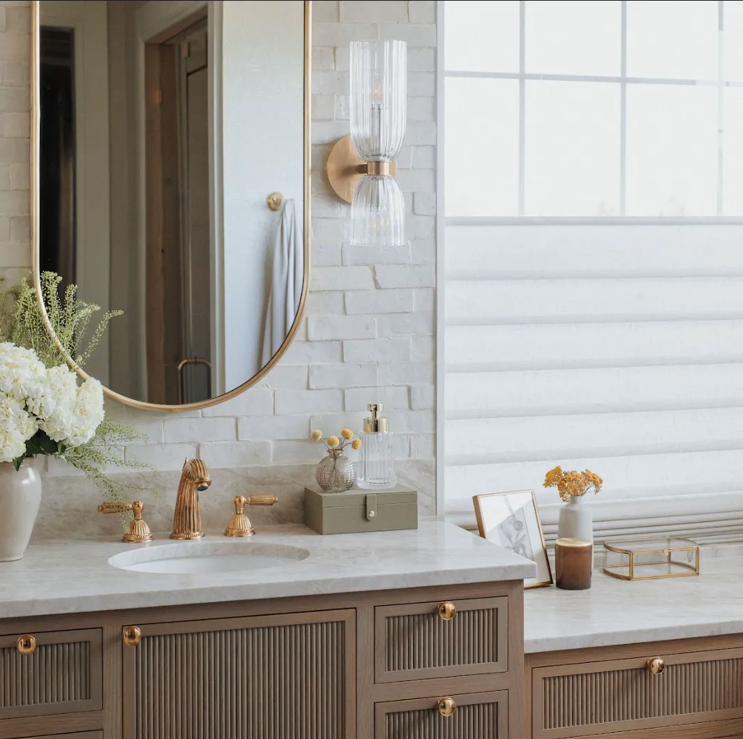 Elegant bedroom with custom woven wood shades by Blinds Couture